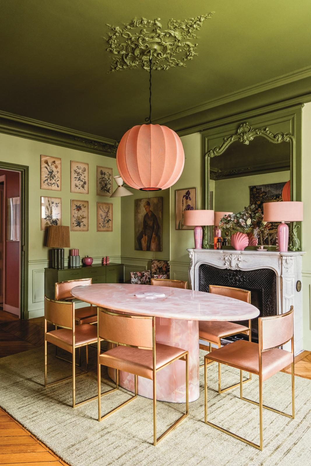 Two shades of green create a moody effect in the dining room