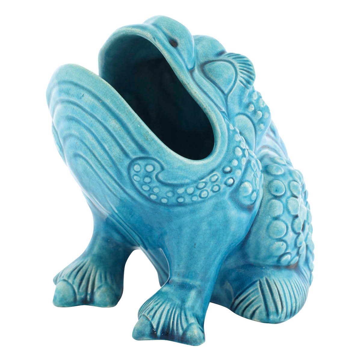 Blue spoon warmer in the shape of a frog