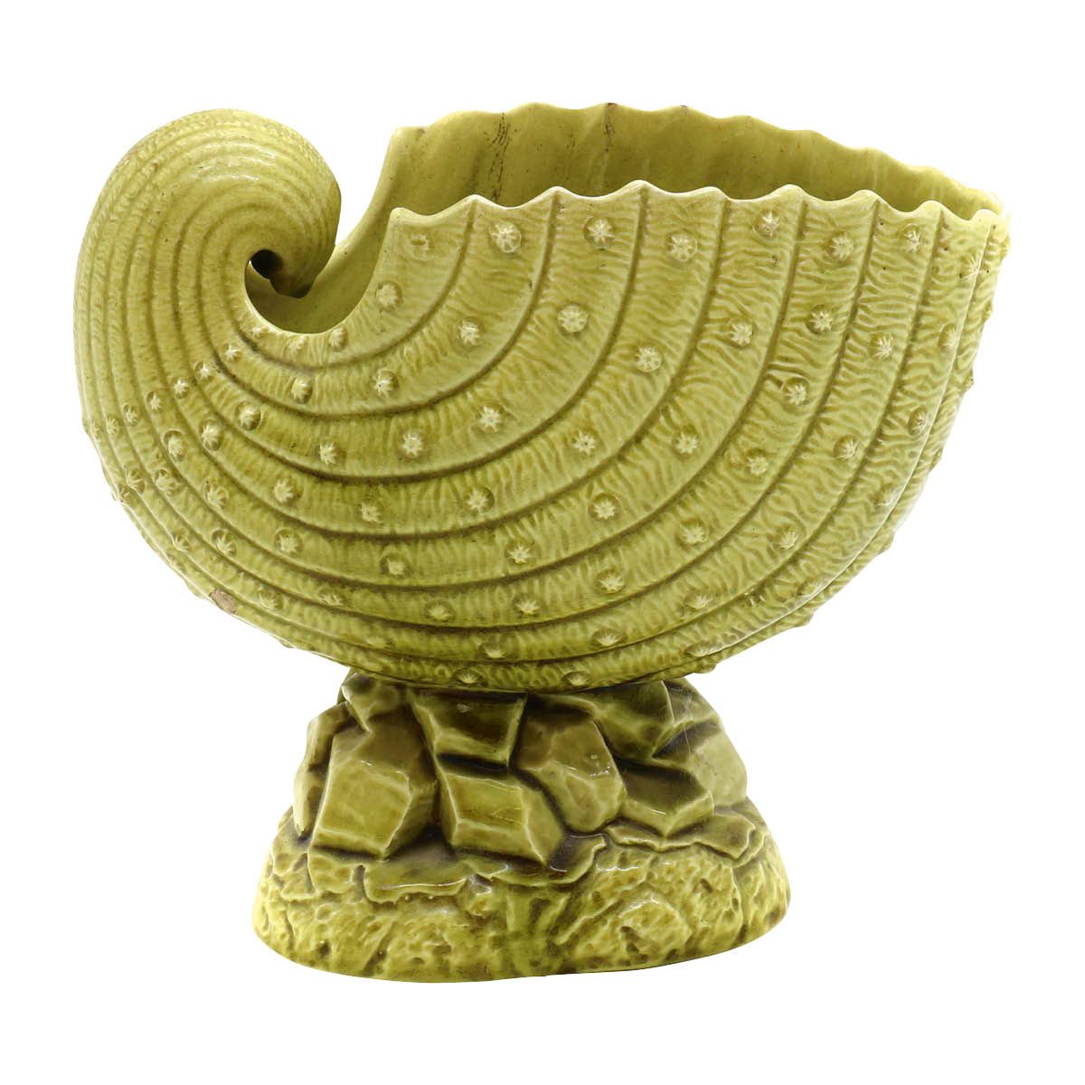 Green ceramic spoon warmer in the shape of a shell