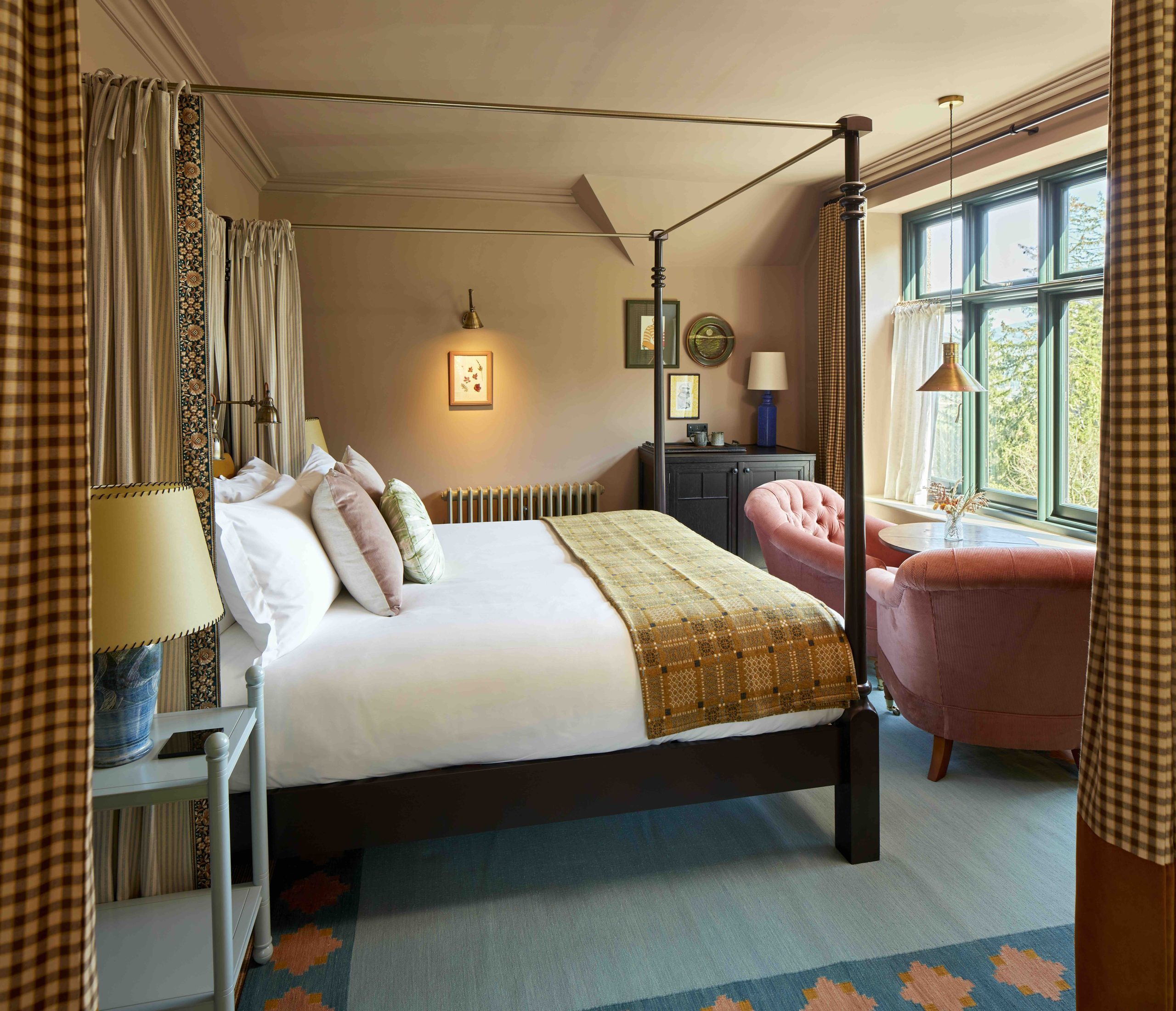 Hotel room with modern four-poster bed